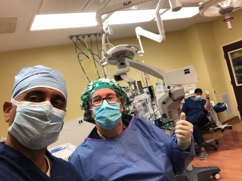 cataract surgery without eye dropsdoctors with masks smiling at camera