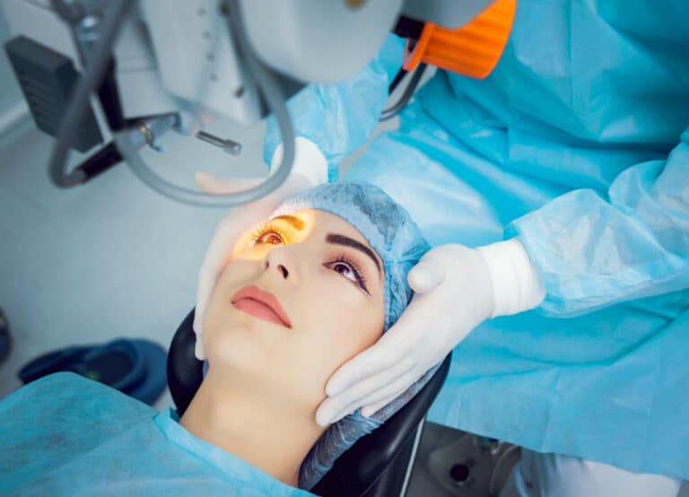 Surgeon observes patient on surgical table