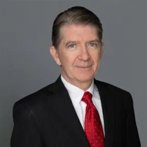 Headshot of David A. Kostick, M.D. in professional wear with a grey background.