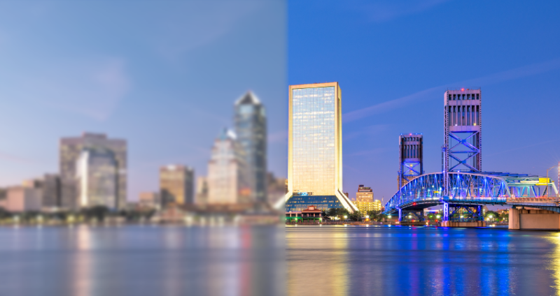 Jacksonville skyline, half of image is blurry and desaturated and the other half is clear