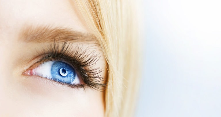 Close-up of a woman's blue eye