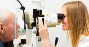 Young Female Doctor Giving Eye Exam